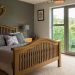 Bedroom with bifold doors - Unique Windows London Ltd